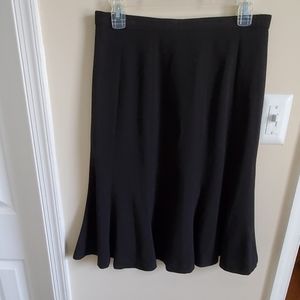 Super cute black skirt.